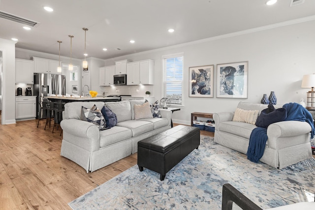 403 Cool Bend Ln, Summerville, SC 29486 - living room featuring crown molding, light wood-style flooring, recessed lighting, and baseboards