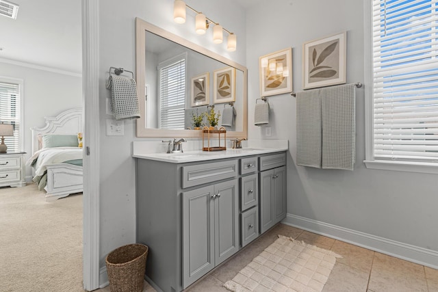 403 Cool Bend Ln, Summerville, SC 29486 - ensuite bathroom with crown molding, double vanity, baseboards, healthy amount of natural light, and tile patterned flooring