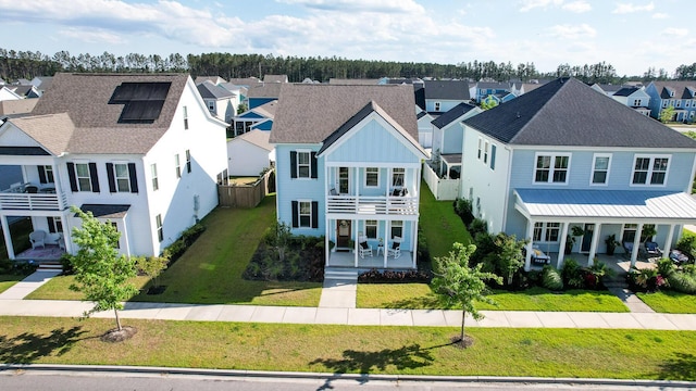 403 Cool Bend Ln, Summerville, SC 29486 - view of front of home featuring a residential view, covered porch, a balcony, board and batten siding, and a front lawn
