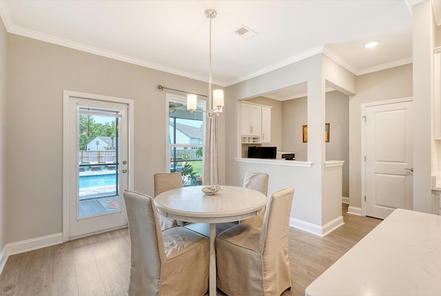 3173 Hugh Bennett Dr, Johns Island, SC 29455 - dining space with light wood-type flooring, baseboards, ornamental molding, and recessed lighting