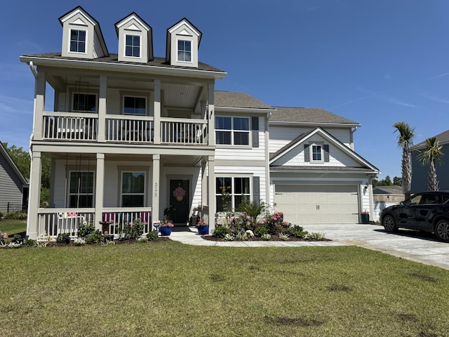 3173 Hugh Bennett Dr, Johns Island, SC 29455 - view of front of house featuring a balcony, covered porch, driveway, a front yard, and a garage