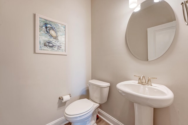 3173 Hugh Bennett Dr, Johns Island, SC 29455 - bathroom featuring baseboards, toilet, and a sink