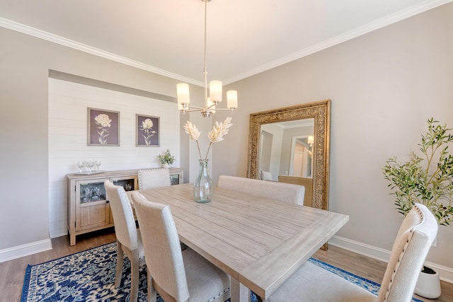 3173 Hugh Bennett Dr, Johns Island, SC 29455 - dining space with a chandelier, ornamental molding, wood finished floors, and baseboards