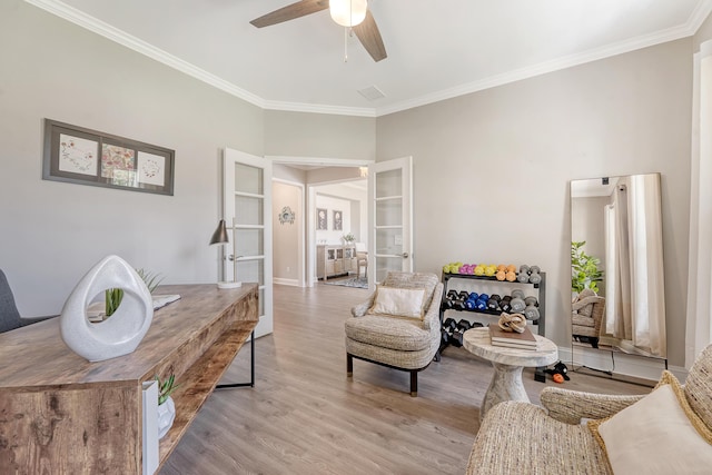 3173 Hugh Bennett Dr, Johns Island, SC 29455 - living area featuring light wood-style floors, ornamental molding, ceiling fan, french doors, and baseboards
