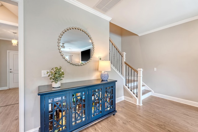 3173 Hugh Bennett Dr, Johns Island, SC 29455 - stairs featuring wood finished floors, baseboards, and crown molding