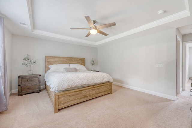 bedroom featuring carpet flooring, a tray ceiling, visible vents, and crown molding
