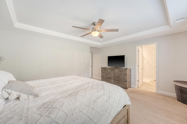 bedroom featuring visible vents, light colored carpet, ornamental molding, and a raised ceiling