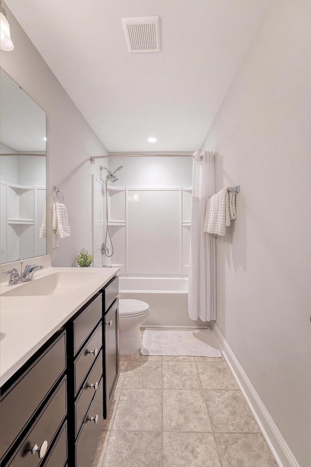 full bath with visible vents, vanity, toilet, baseboards, and shower / bath combination