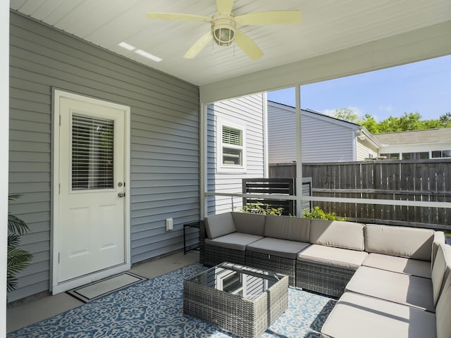 sunroom / solarium with ceiling fan and outdoor lounge area