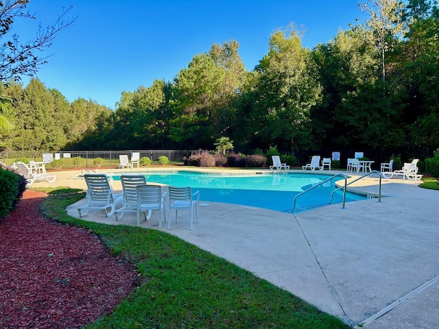 view of swimming pool with a patio