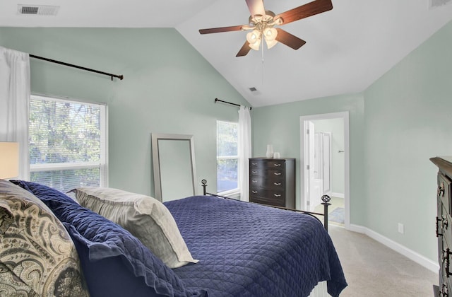 carpeted bedroom with ceiling fan and high vaulted ceiling