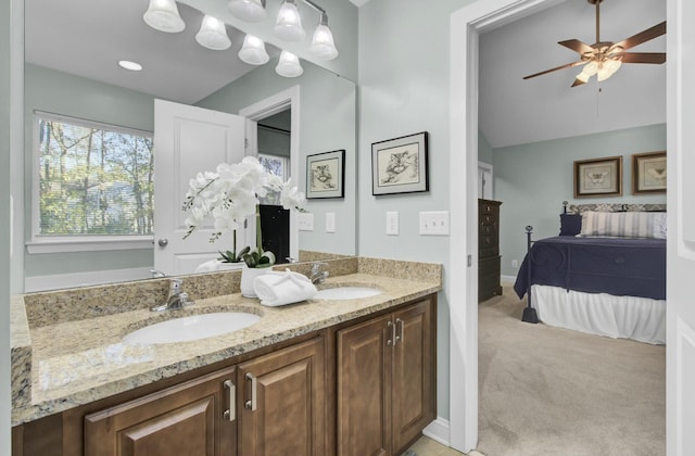 bathroom with ceiling fan and vanity