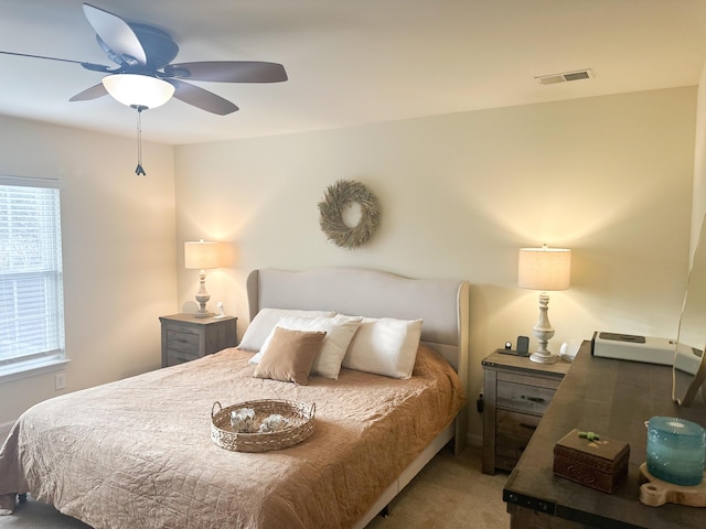 carpeted bedroom with ceiling fan