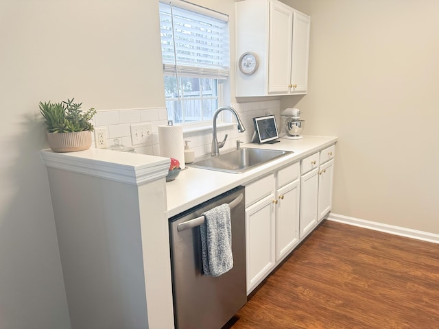 kitchen with tasteful backsplash, stainless steel dishwasher, sink, and white cabinets