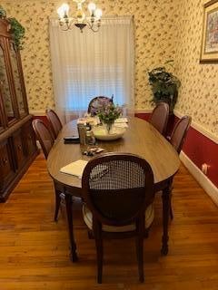 dining room featuring a chandelier and hardwood / wood-style flooring