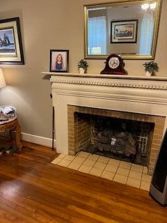 room details featuring hardwood / wood-style flooring and a fireplace