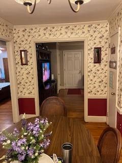 dining area with crown molding