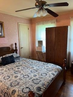 bedroom with dark wood-type flooring and ceiling fan