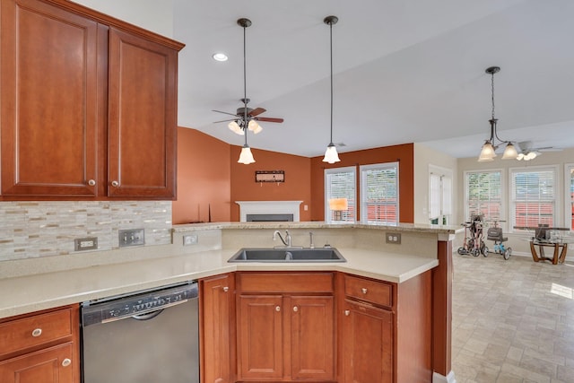 kitchen featuring dishwasher, sink, decorative light fixtures, lofted ceiling, and ceiling fan with notable chandelier