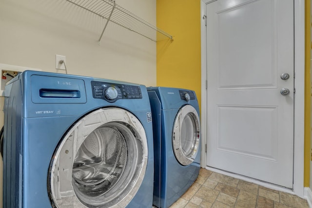 laundry room featuring washer and clothes dryer