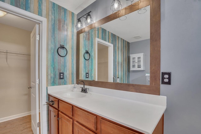 bathroom with vanity and wood-type flooring