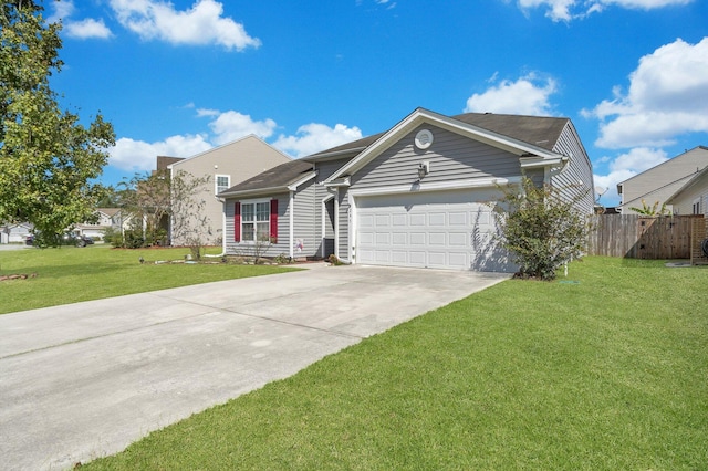 view of front of house with a front yard and a garage