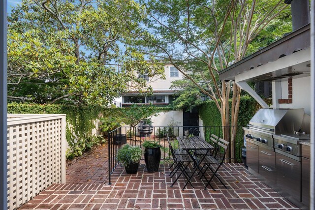 1661/2 Queen St, Charleston, SC 29401 - view of patio / terrace featuring area for grilling, fence, and exterior kitchen