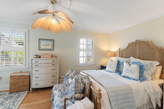 1661/2 Queen St, Charleston, SC 29401 - bedroom with multiple windows, crown molding, and wood finished floors