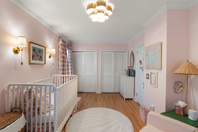 1661/2 Queen St, Charleston, SC 29401 - hall with light wood-style flooring, crown molding, and a chandelier