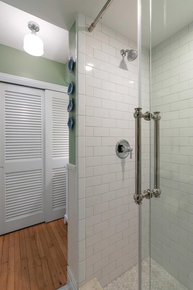 1661/2 Queen St, Charleston, SC 29401 - bathroom with a stall shower and wood finished floors
