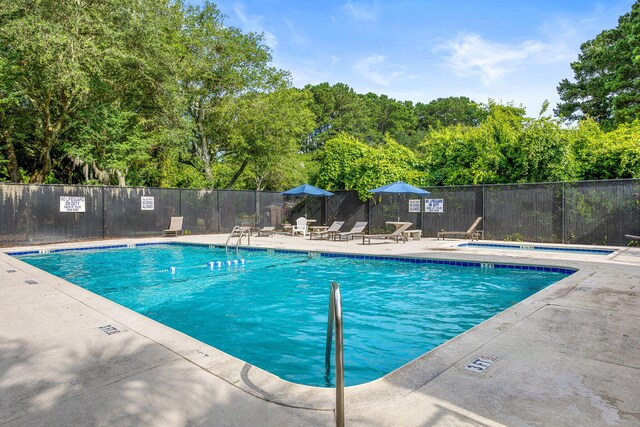 view of pool featuring a patio