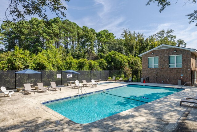 view of swimming pool featuring a patio