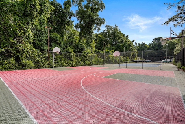 view of sport court featuring tennis court