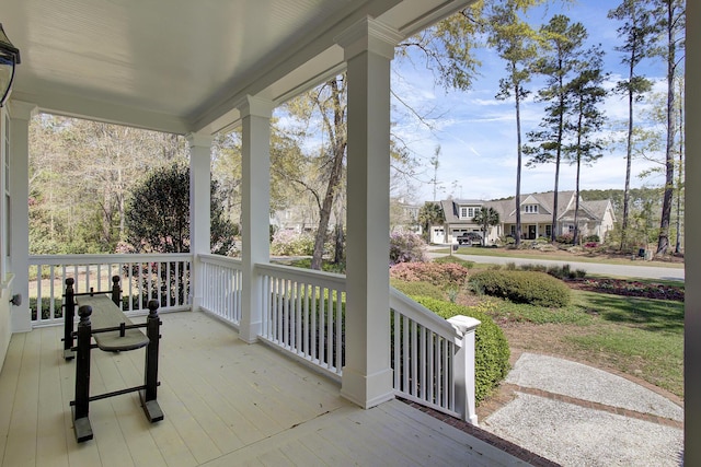 view of patio / terrace with a porch and a residential view