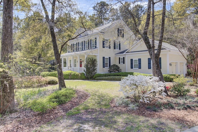 colonial inspired home with a front yard