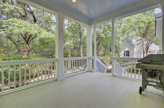 unfurnished sunroom with healthy amount of natural light