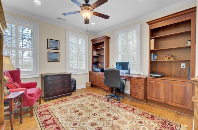 office featuring plenty of natural light, ceiling fan, light wood-style flooring, crown molding, and recessed lighting