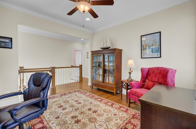 office space with wood finished floors, ceiling fan, crown molding, recessed lighting, and baseboards