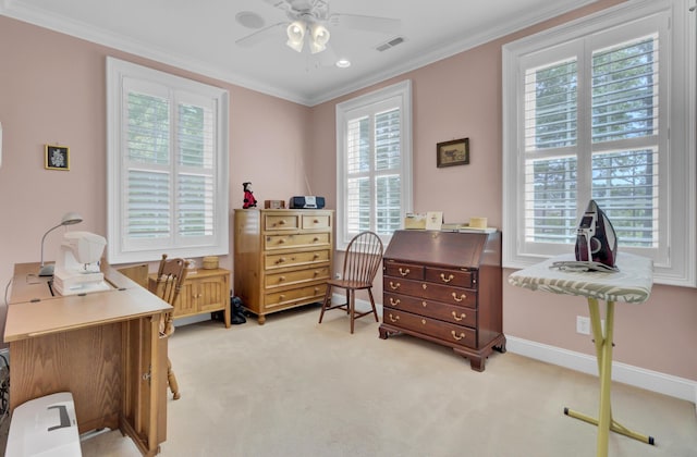 bedroom with multiple windows, light carpet, ornamental molding, and a desk