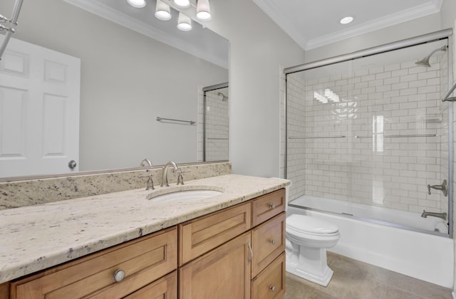 bathroom with toilet, tile patterned floors, vanity, ornamental molding, and tub / shower combination