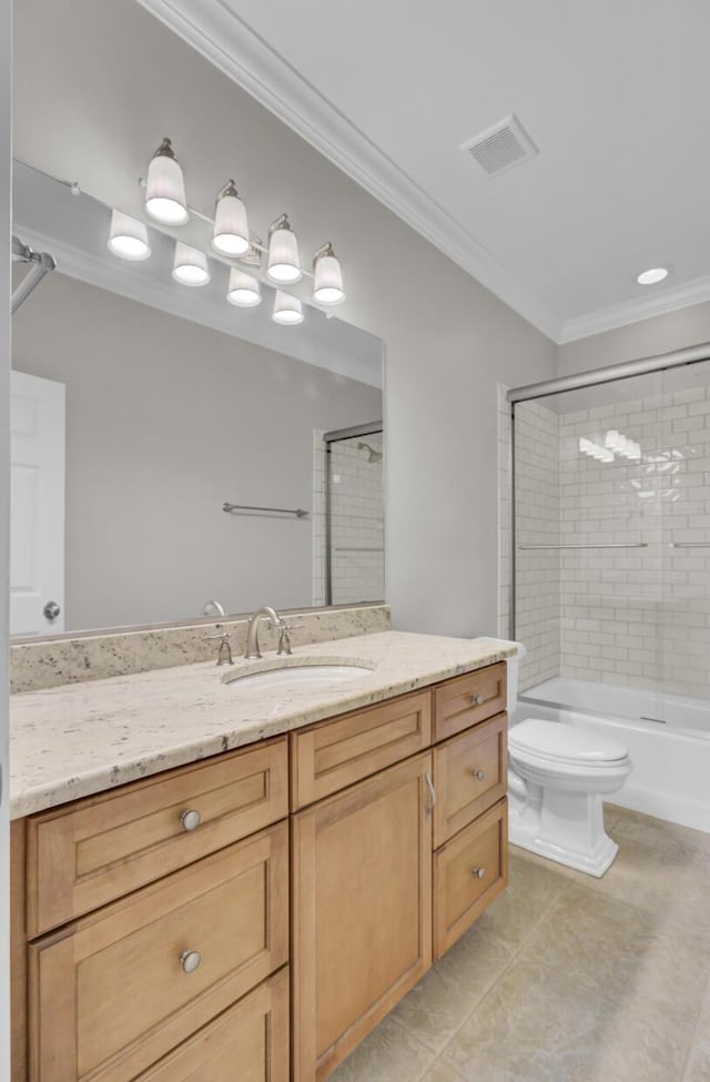 full bath with toilet, tile patterned floors, vanity, crown molding, and washtub / shower combination