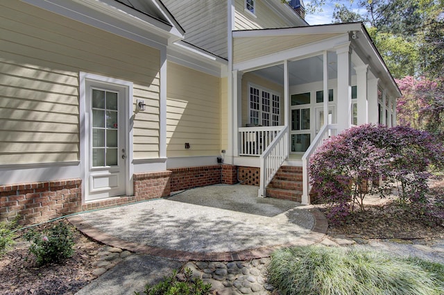 doorway to property featuring a porch