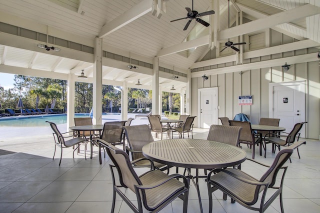 view of patio with ceiling fan, outdoor dining area, and a community pool