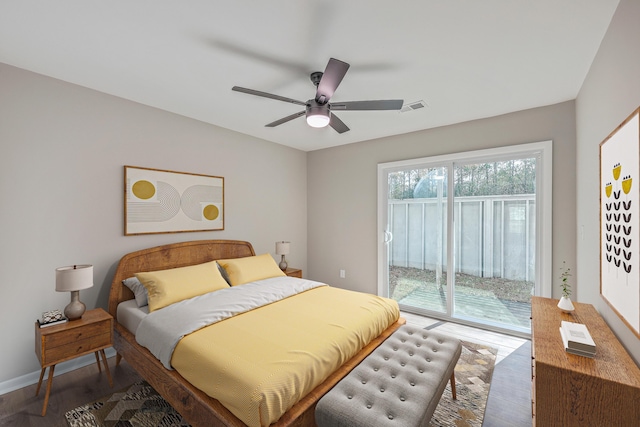 bedroom featuring ceiling fan, access to exterior, and dark hardwood / wood-style floors