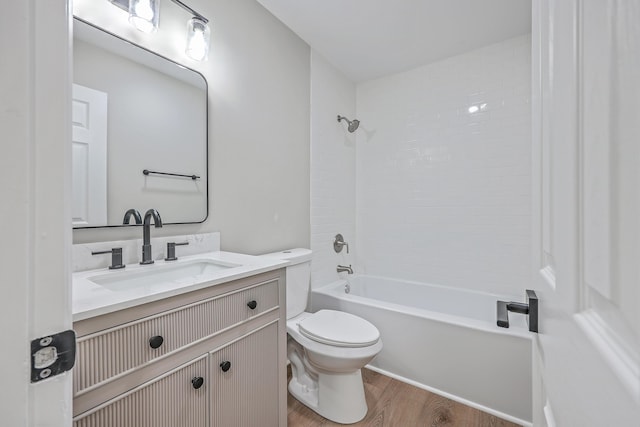 full bathroom featuring toilet, vanity, shower / bathing tub combination, and hardwood / wood-style flooring