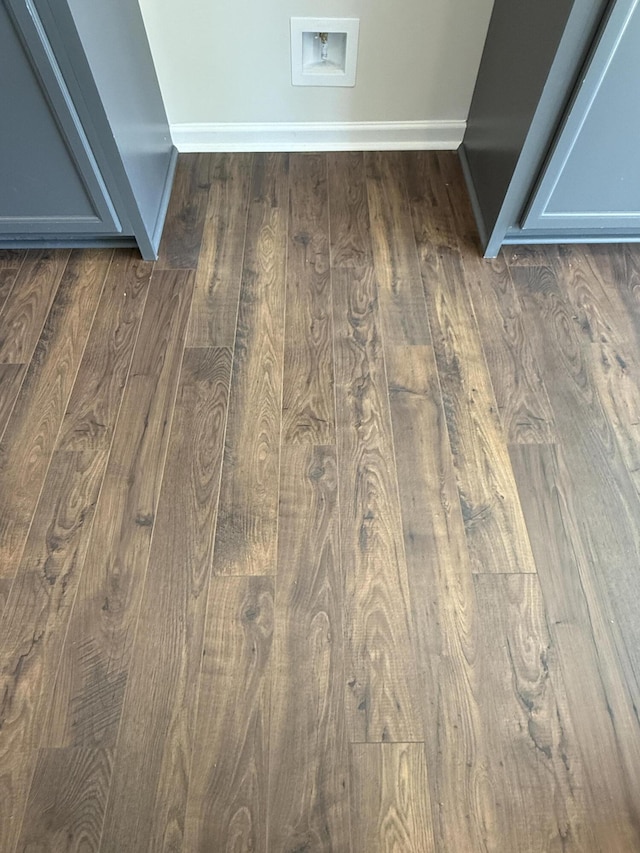 interior details with baseboards and wood finished floors