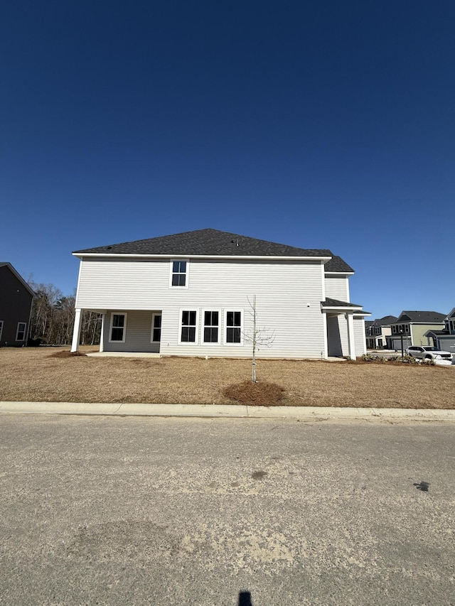 view of front of property with a shingled roof