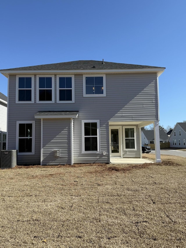 back of property with a patio and central AC unit