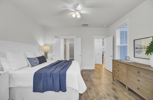 bedroom featuring ceiling fan and wood-type flooring