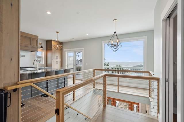 1568 E Ashley Ave, Folly Beach, SC 29439 - kitchen with a chandelier, a sink, a water view, pendant lighting, and recessed lighting